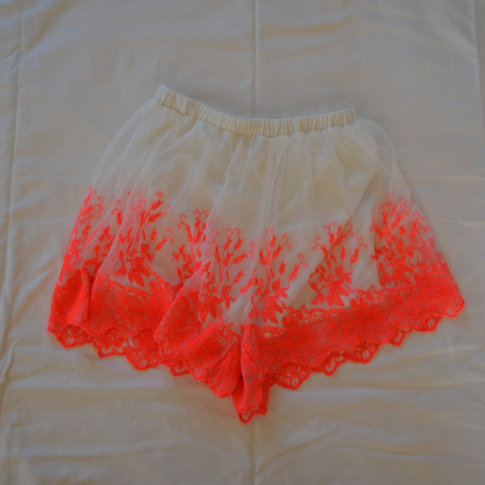 White and neon Pink shorts